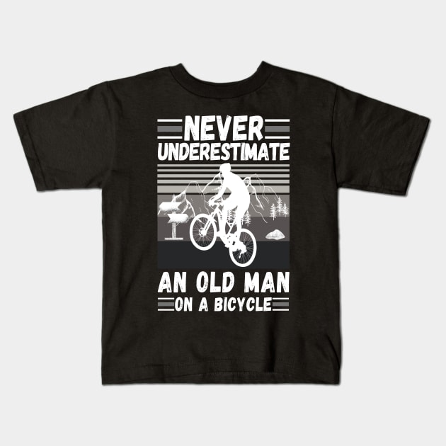 never underestimate an old man on a bicycle Kids T-Shirt by JustBeSatisfied